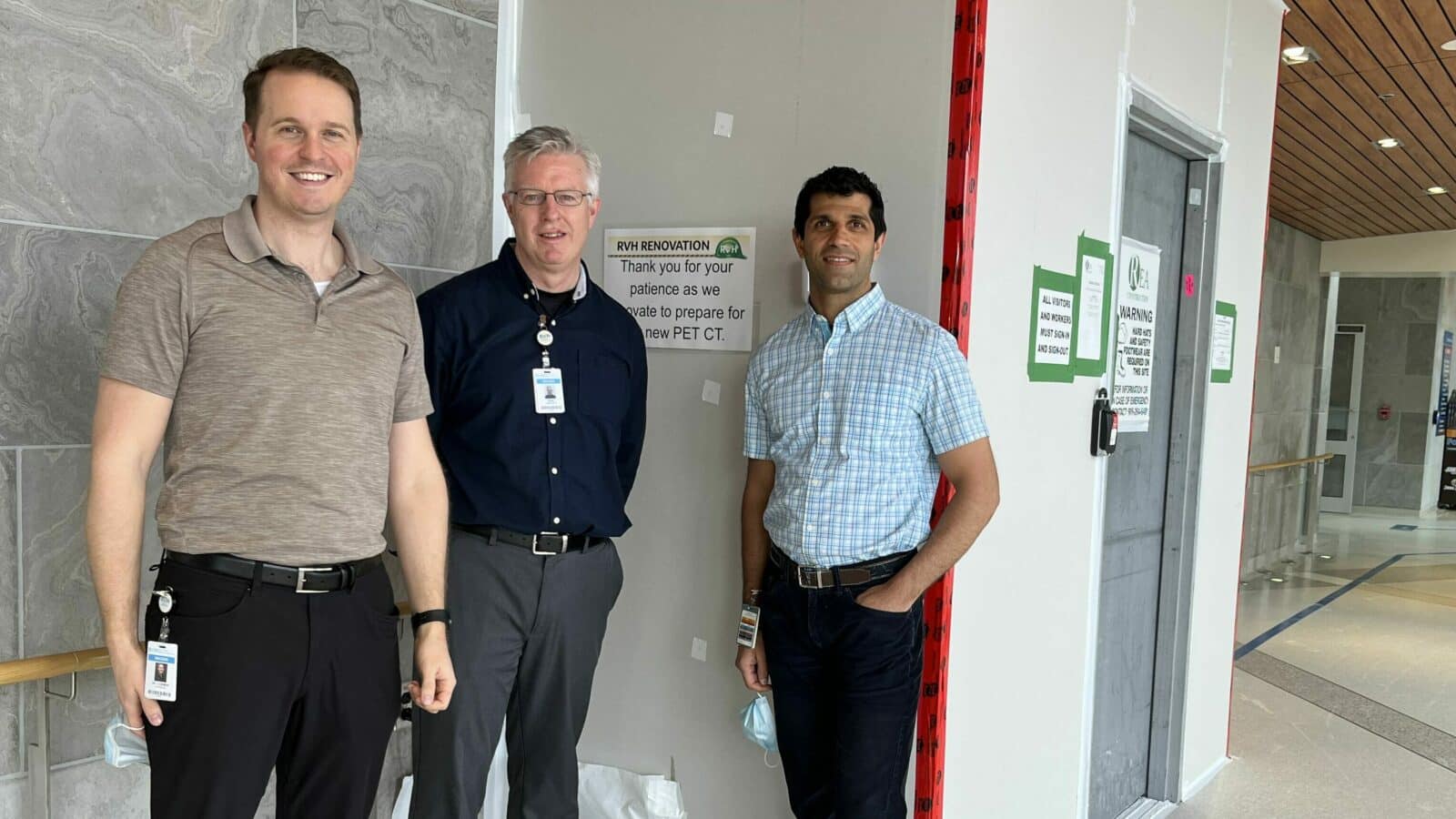 Radiologist and PET-CT Lead, Dr. Cory Ozimok, Manager of Medical Imaging, David Wilson and Medical Director of Imaging, Dr. Raj Grover stand outside the area where construction is underway to make space for the new PET-CT scanner at RVH.